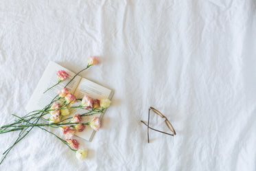 book, flowers & glasses flatlay