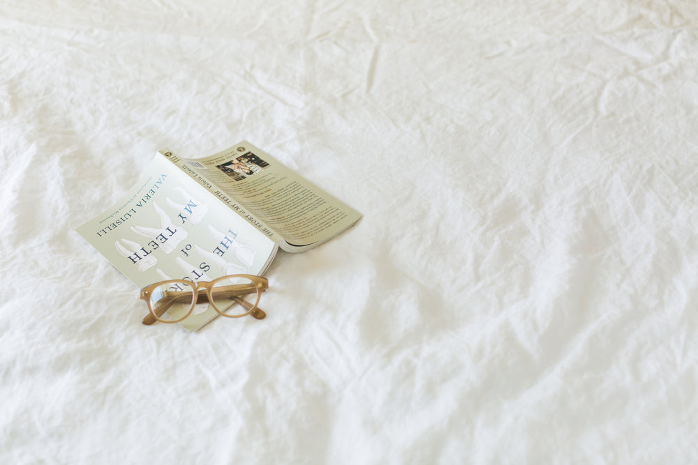 book glasses on linen