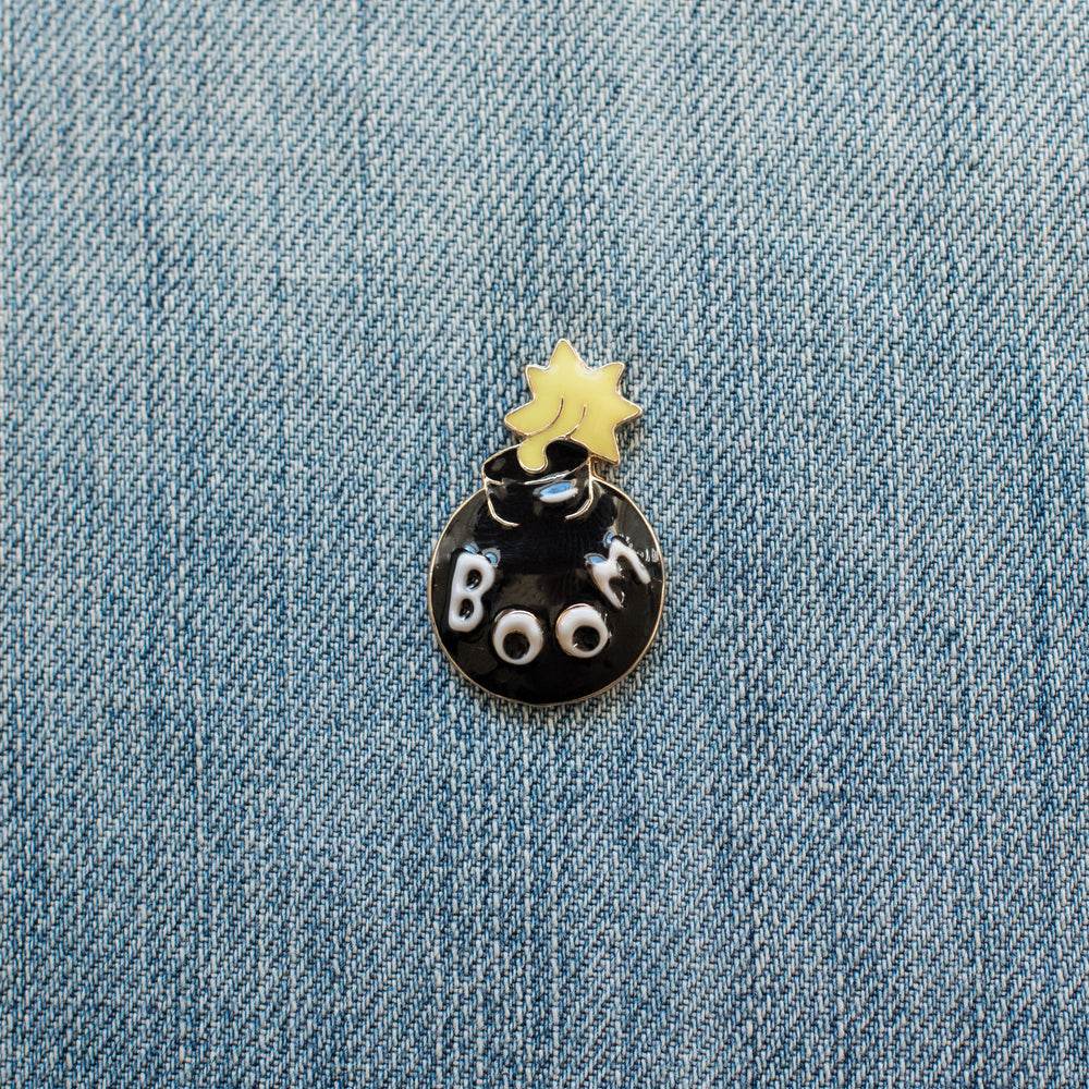 boom bomb enamel pin on denim