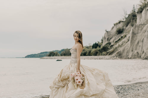 bouquet billowing skirt and beaded bodice wedding dress