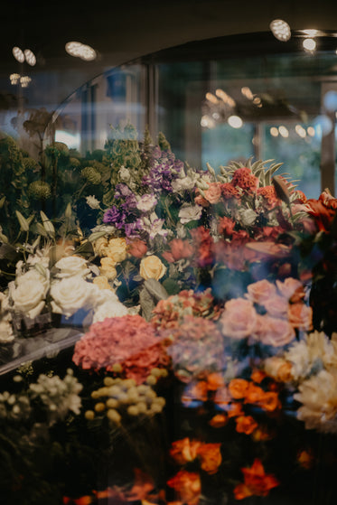 bouquets of flowers on display in window
