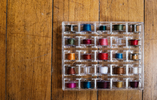 box of colorful thread
