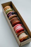 boxed macarons in a line