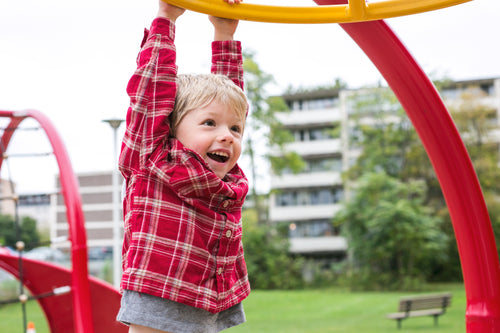 boy hanging at playground