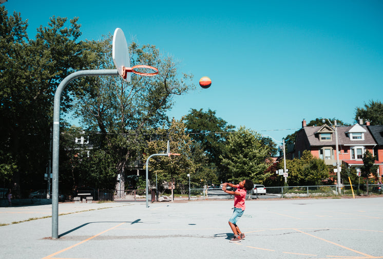 Boy Throws Basketball