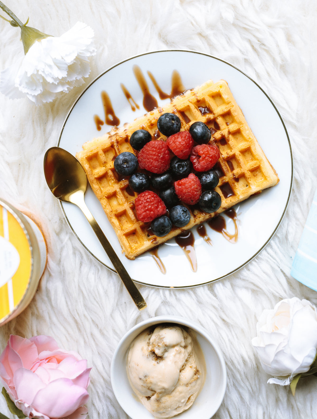 breakfast flatlay with fruit and waffles