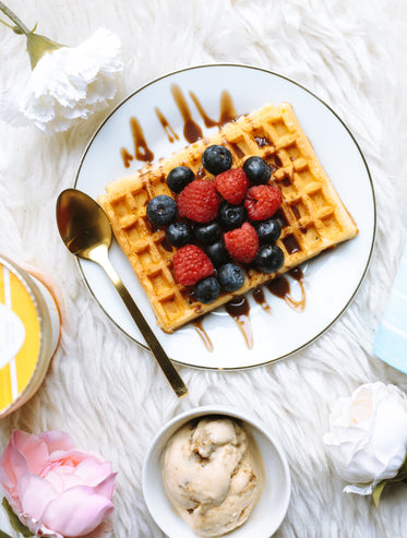 breakfast flatlay with fruit and waffles