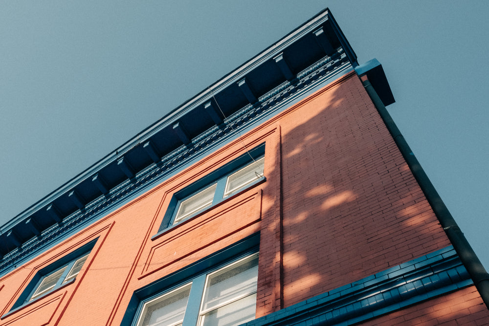 brick building with blue detail