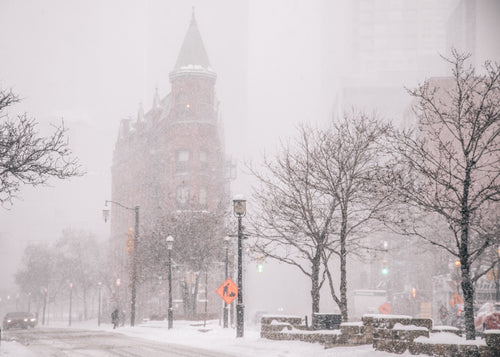 brick office building with turret in blizzard