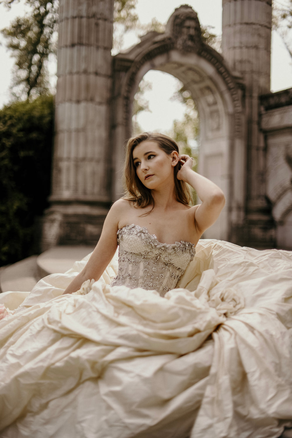 bride adjusts hair wedding photography