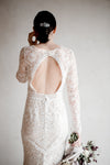bride in lace wedding dress holding bouquet