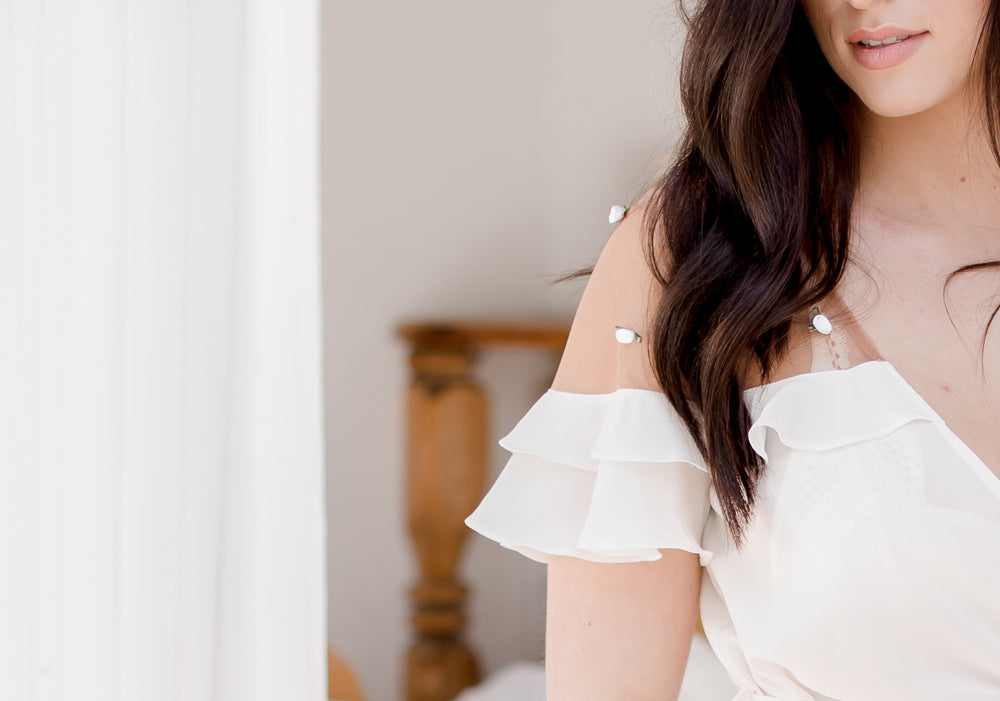 bride wearing wedding dress with roses