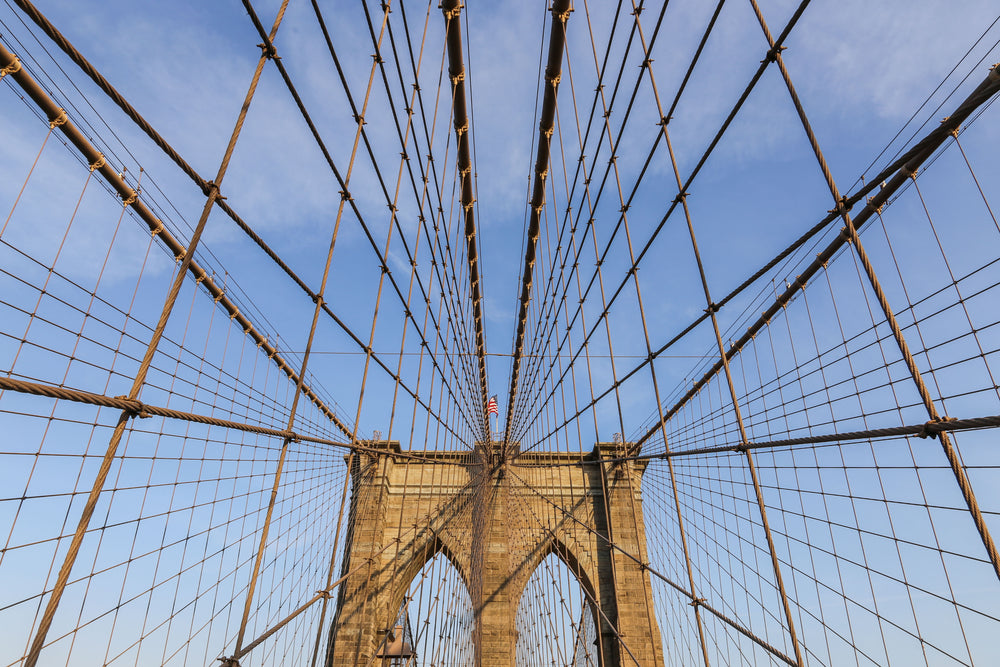 bridge wires against blue sky