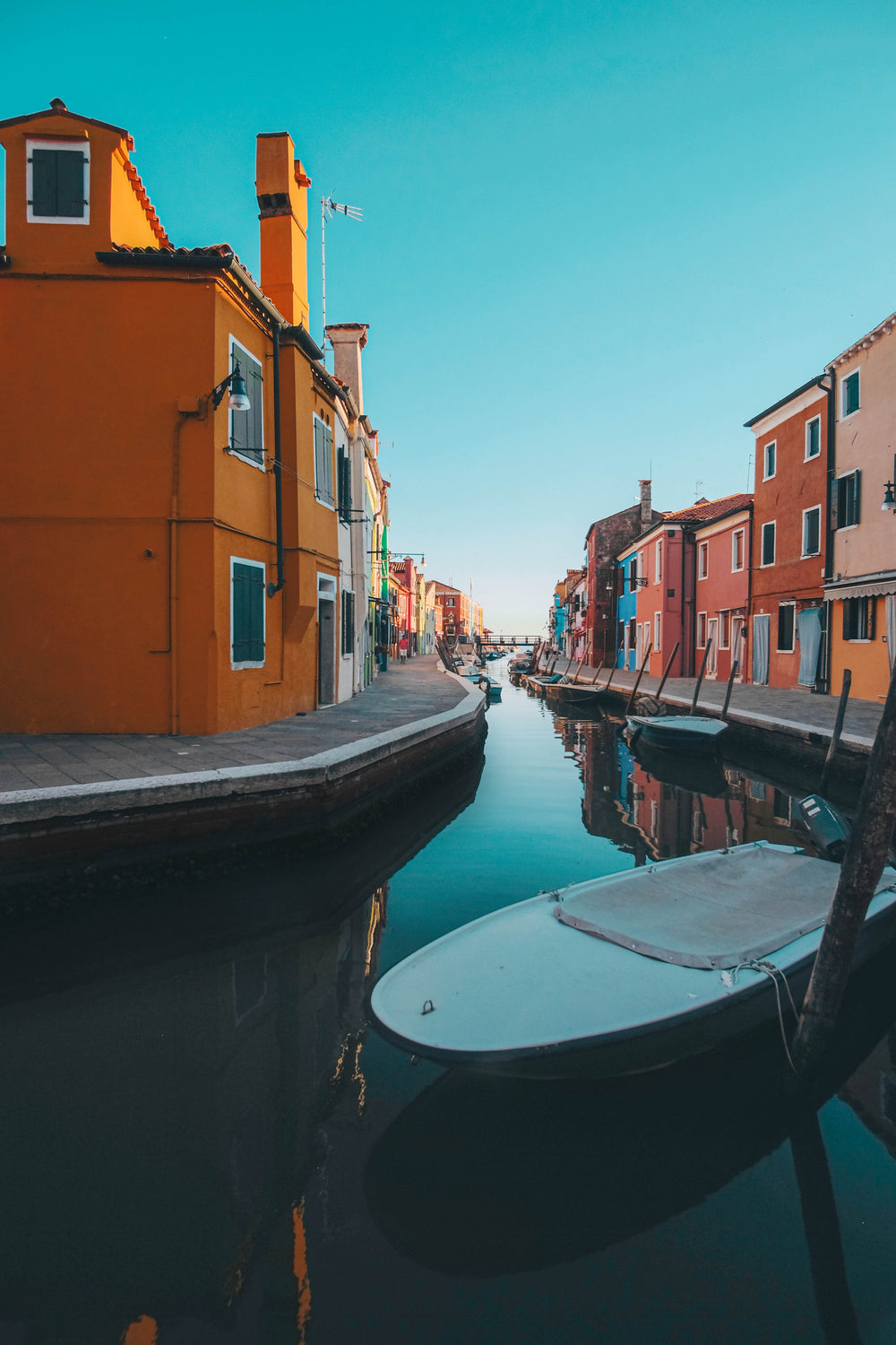 bright colorful buildings line a canal