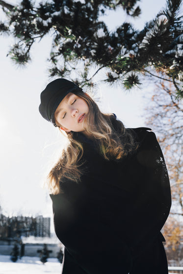 bright winter light behind blond woman