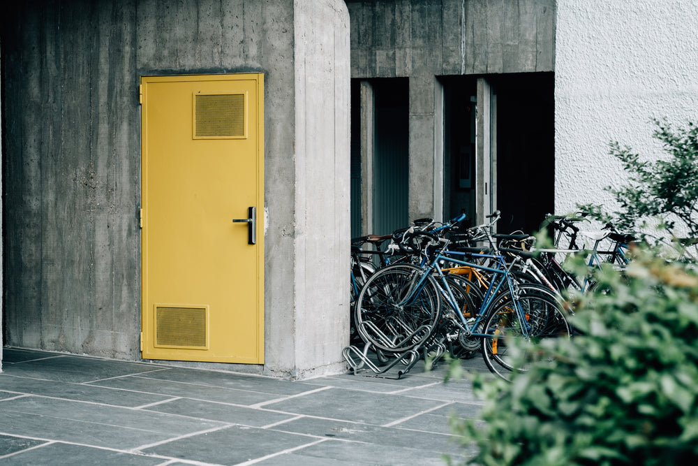 bright yellow doorway and parked bikes