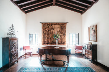 brightly lit room with piano