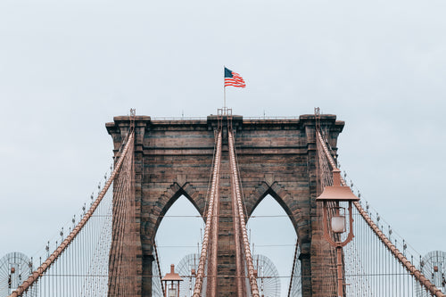 brooklyn bridge with flag