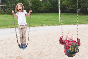 Free Stock Photo of Brother & Sister On Swings — HD Images