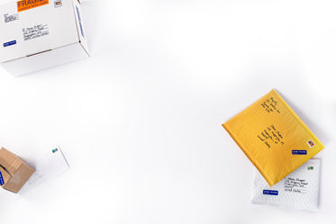 brown and white boxes laid on table