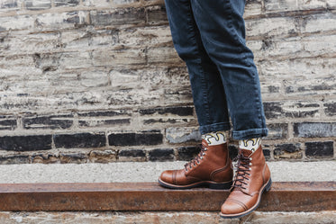 brown boots on the curb