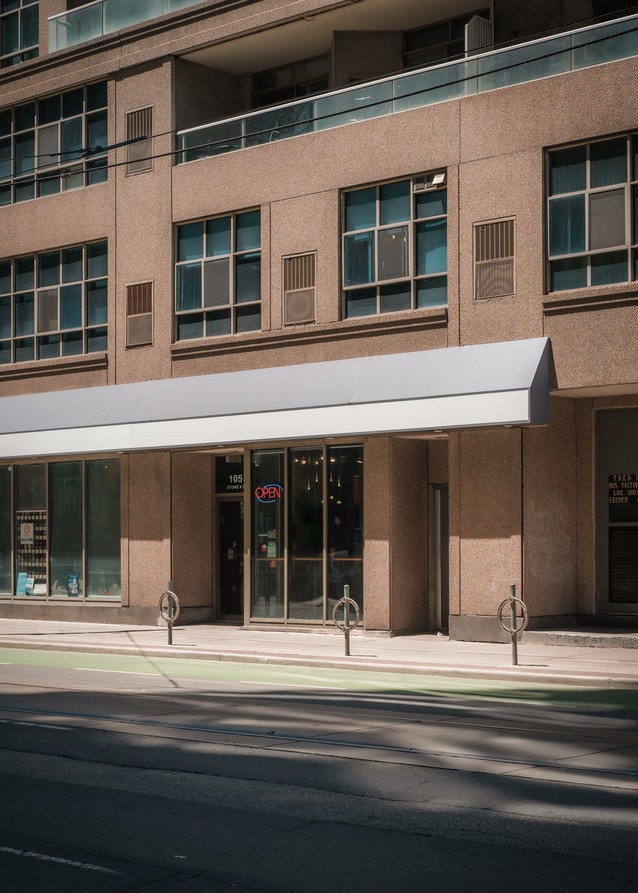 Browse Free HD Images of Brown Building Lining A City Street