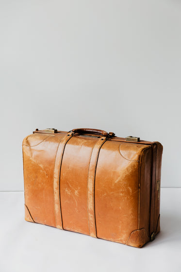 brown leather suitcase