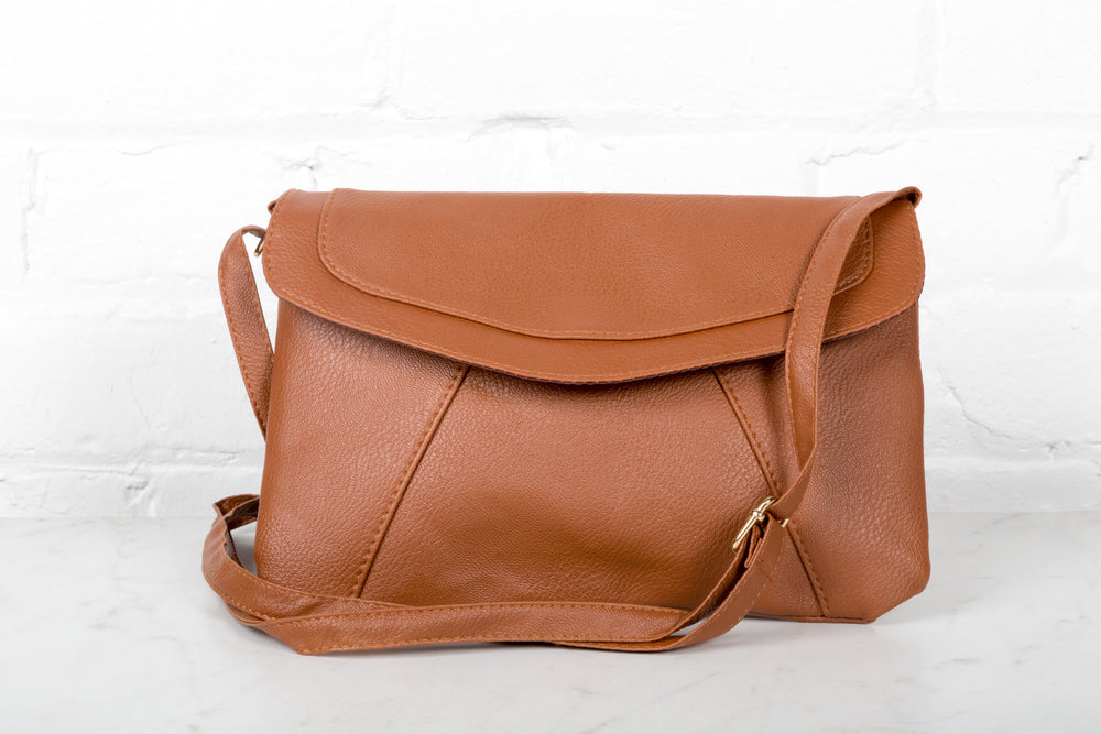 brown purse with shoulder strap