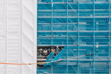 builders chatting on scaffolding