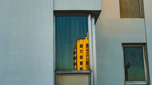 building reflected in window