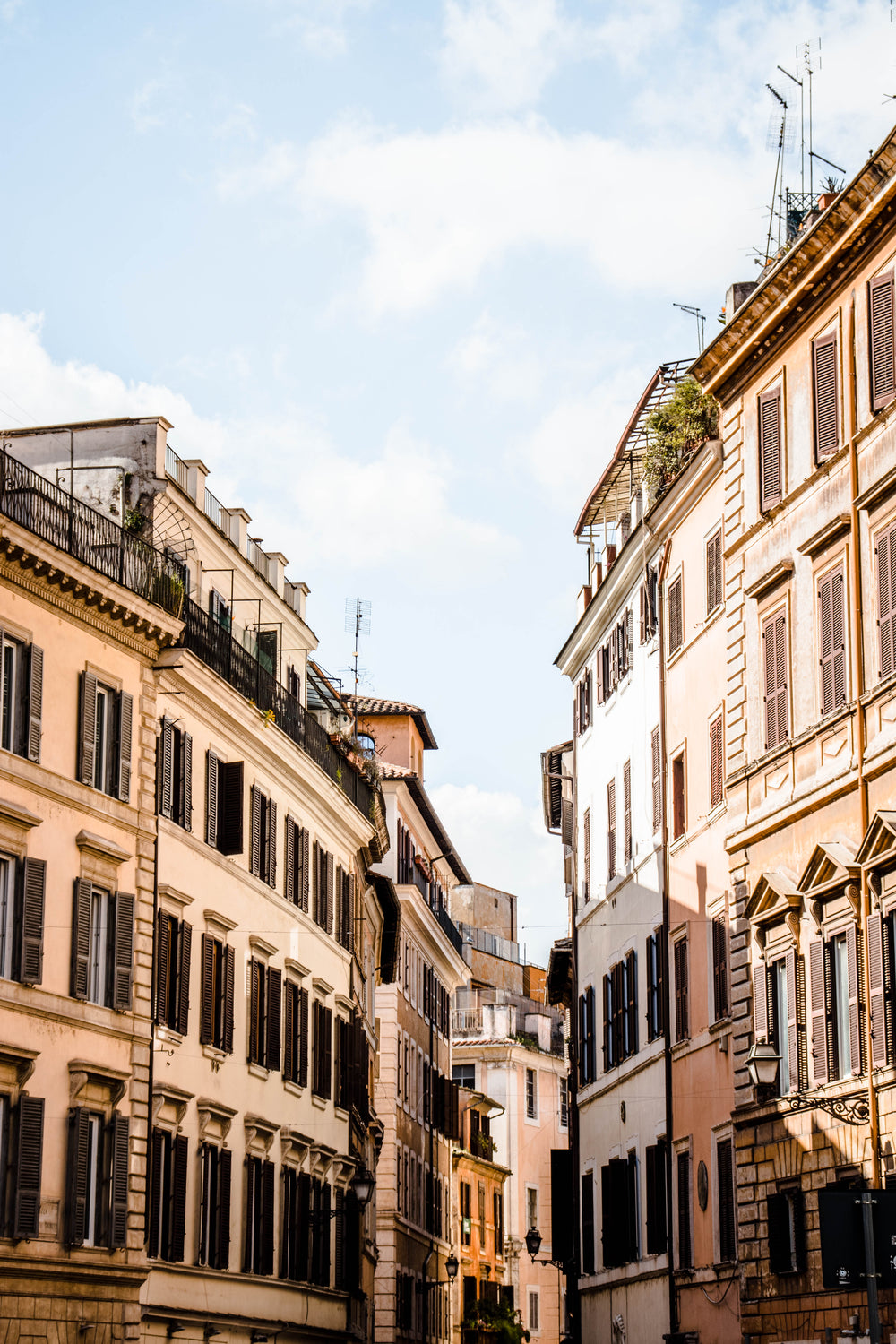 buildings curve together against a blue sky