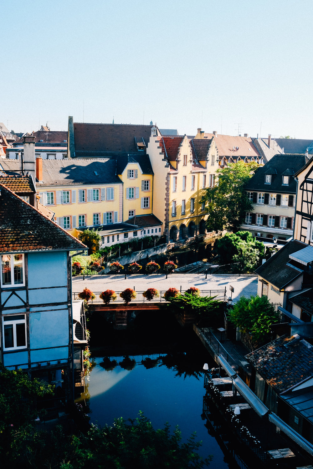 buildings of all colors overlooking river