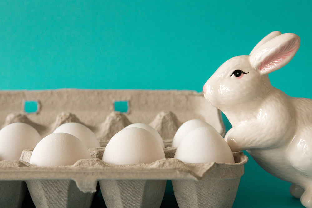 bunny statue watches eggs