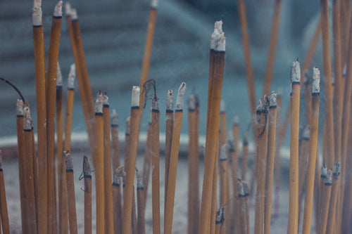 burning incense sticks in temple