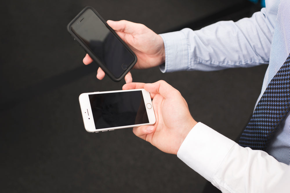 businessmen hold blank iphone