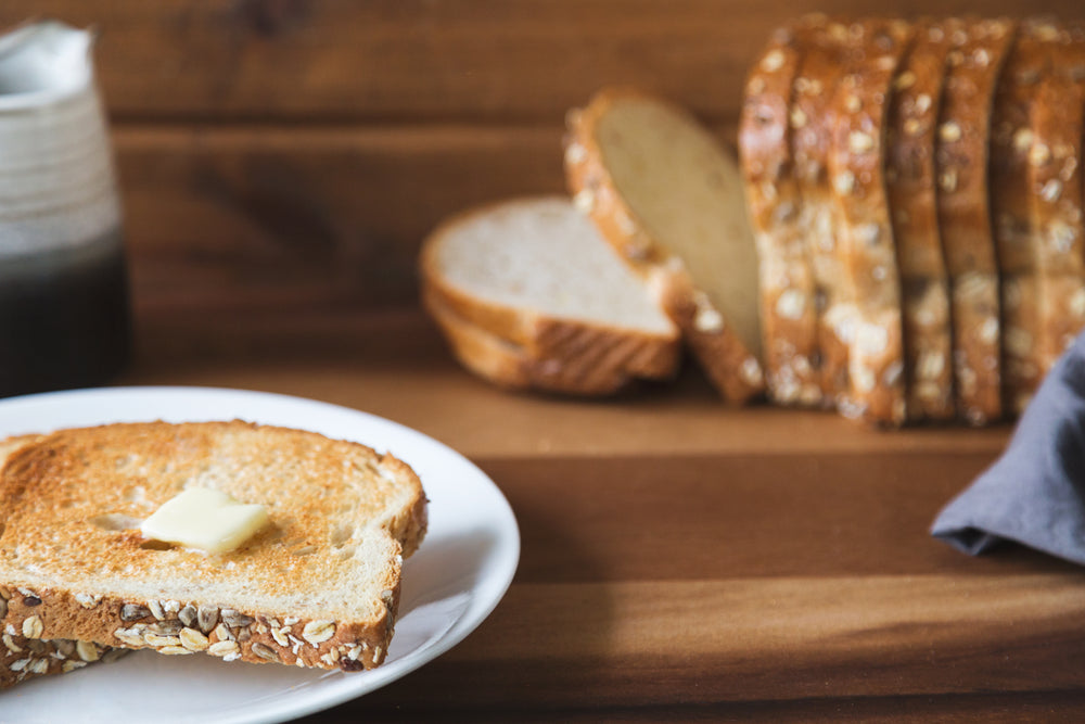 buttered toast on cutting board