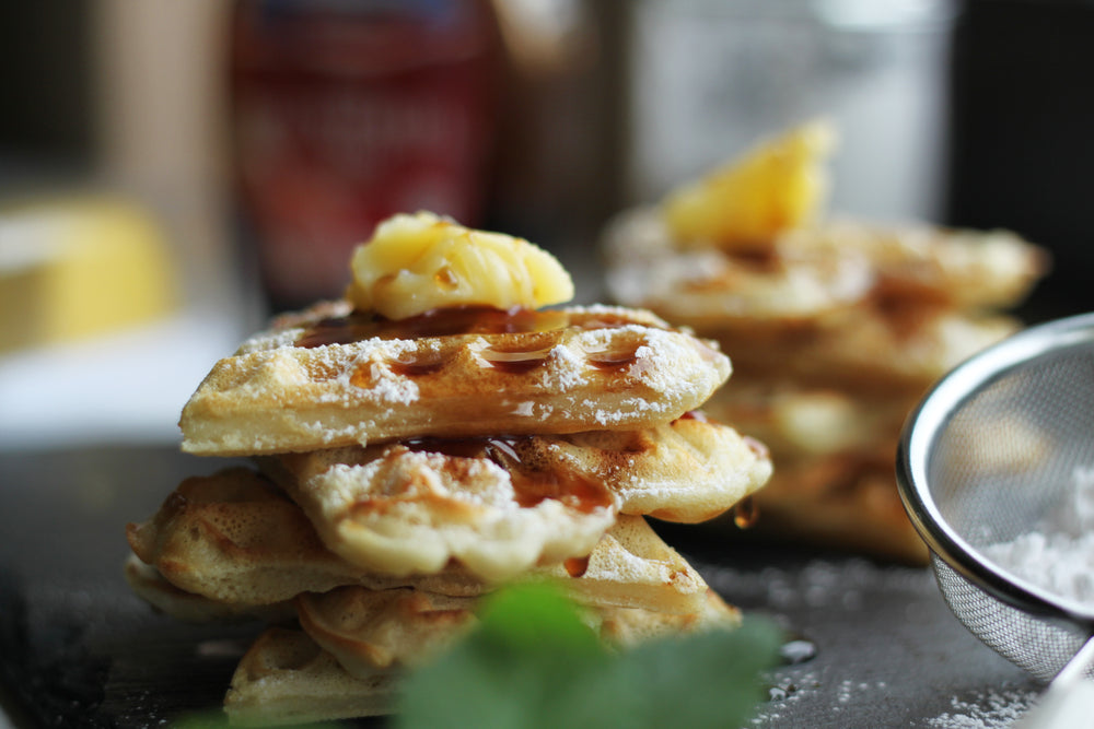 buttered waffles with powdered sugar