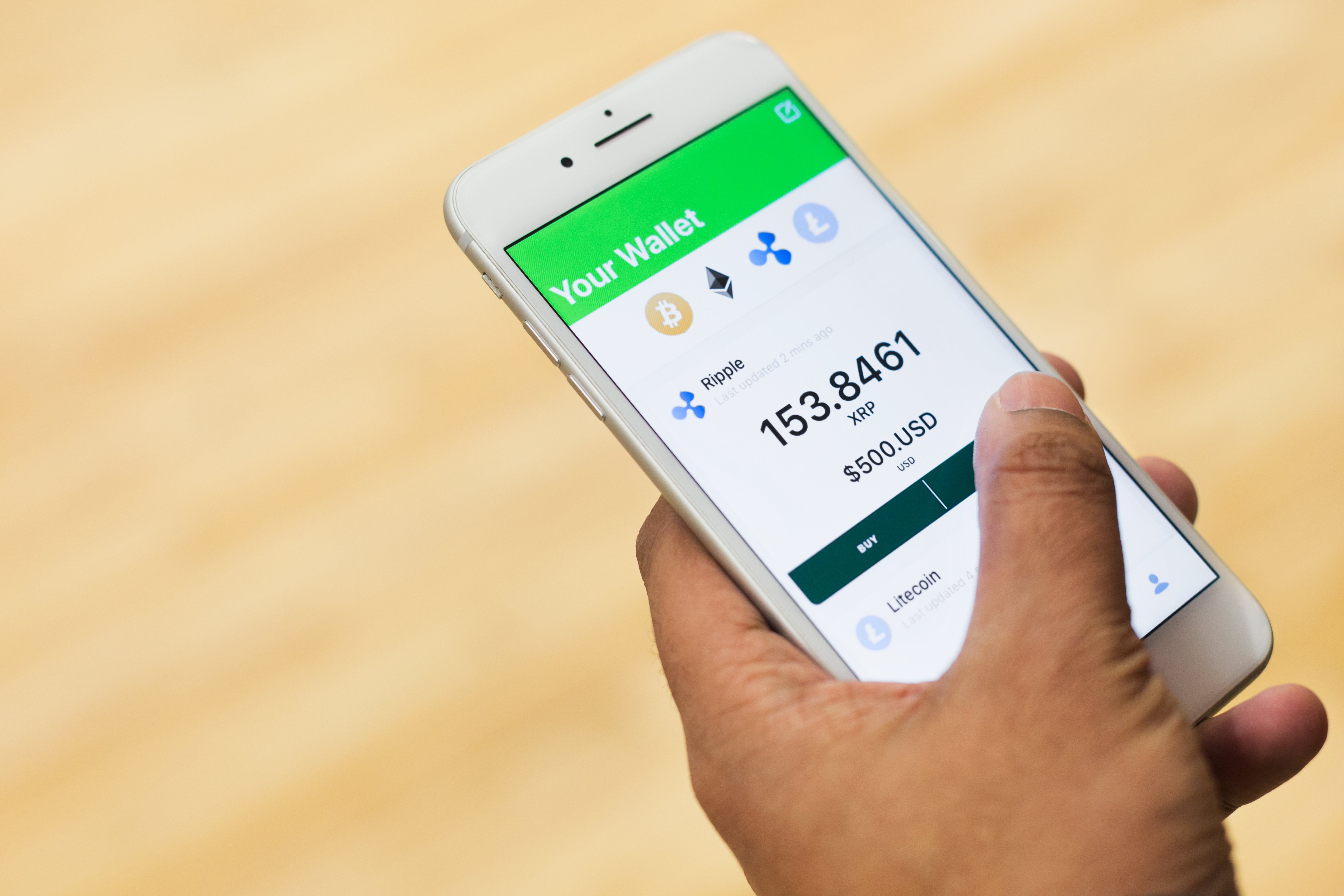 Picture of Buying Cryptocurrency Ripple On Phone — Free Stock Photo