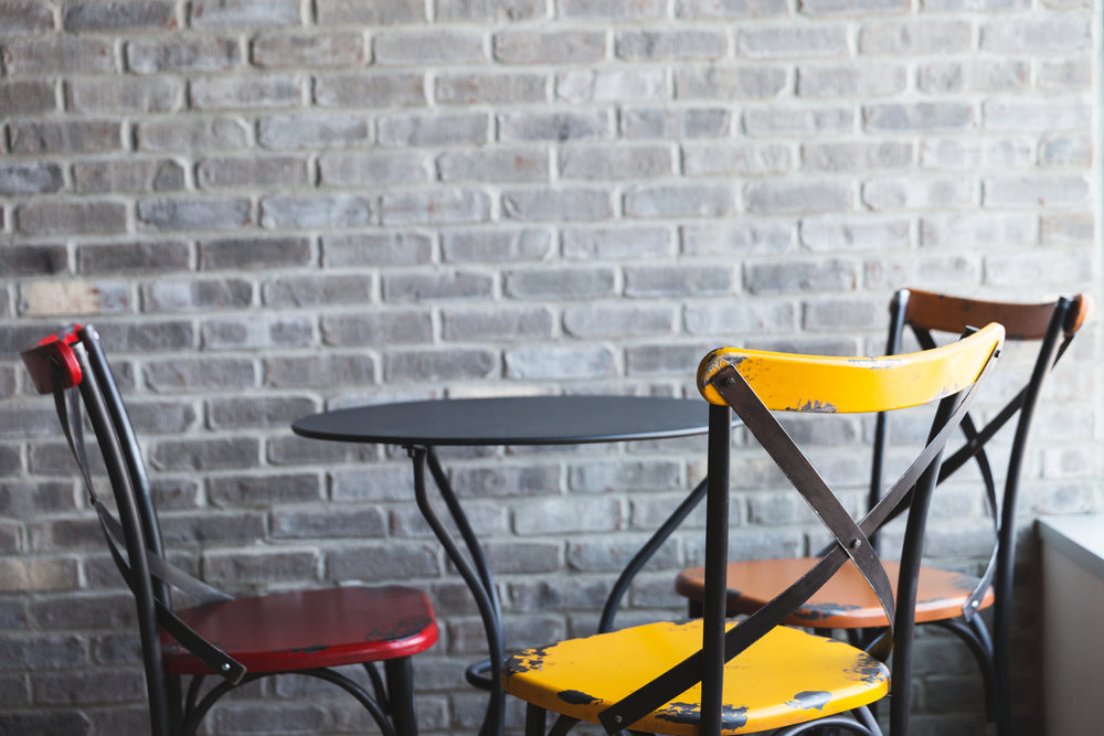 cafe chairs and brick wall