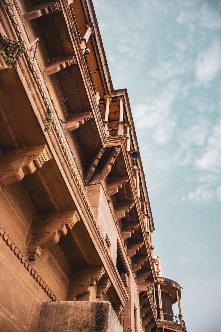 Camera Looks Up To A Rust Colored Building