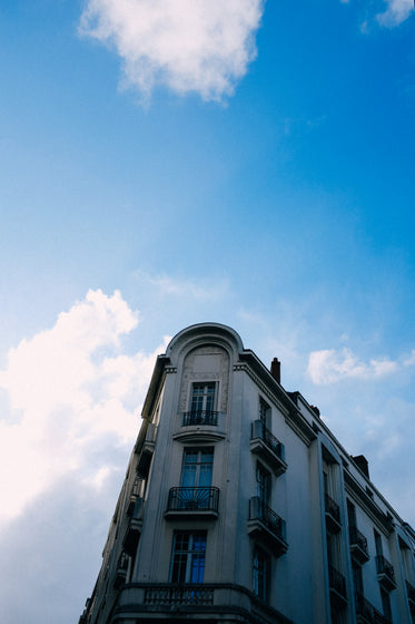 camera looks up to the top of a curvy building