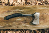 camping hatchet on wood