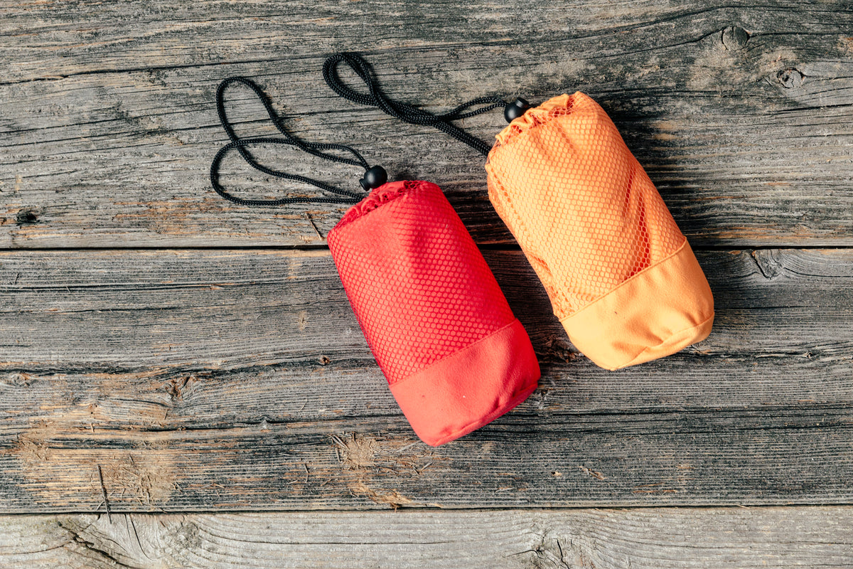 camping waterproof bag orange and red wrapped up