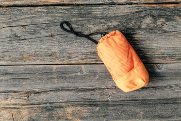 camping waterproof bag orange wrapped up