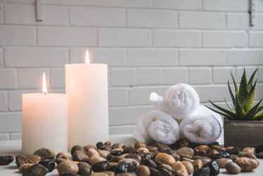 candles stones and towels