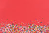 candy sprinkle red background
