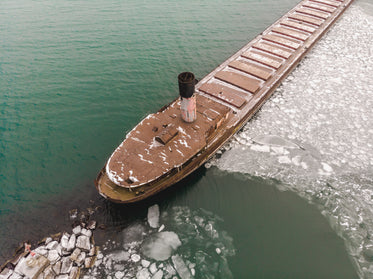 cargo ship surrounded by ice