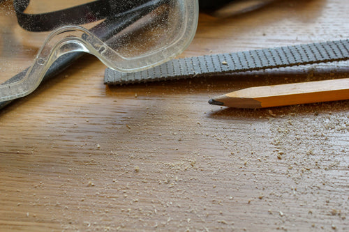 carpentry tools covered in sawdust
