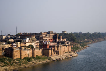 castle like building sits on the shoreline