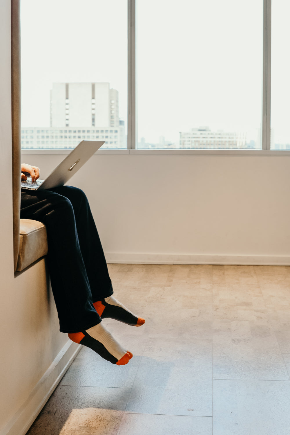 casual workspace feet dangling